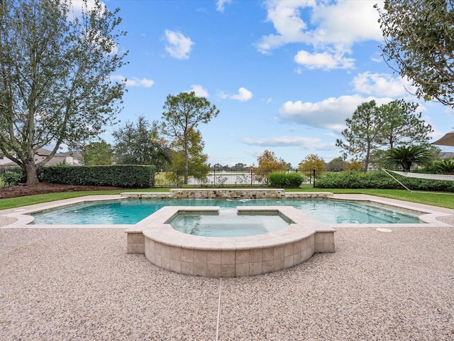 view of pool featuring an in ground hot tub