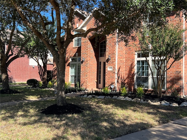 view of property exterior with a yard