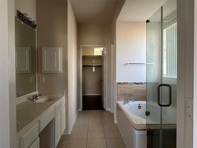 bathroom featuring tile patterned floors, separate shower and tub, and vanity