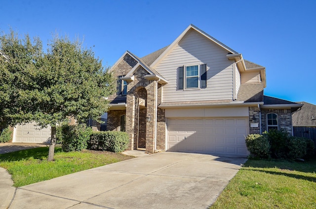 view of front of home featuring a garage and a front yard