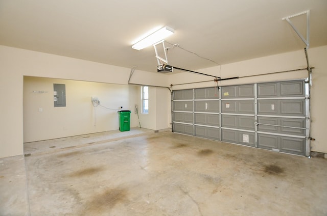 garage featuring electric panel and a garage door opener