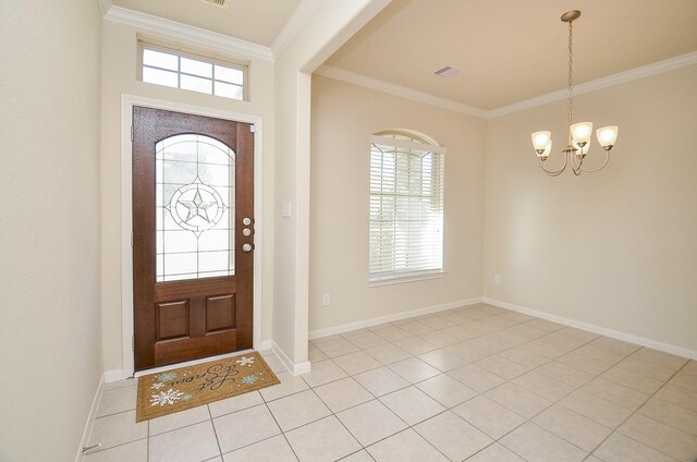 entrance foyer with crown molding, light tile patterned floors, and a chandelier