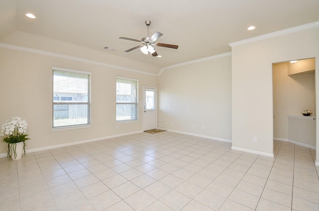 empty room with light tile patterned floors, lofted ceiling, ceiling fan, and crown molding