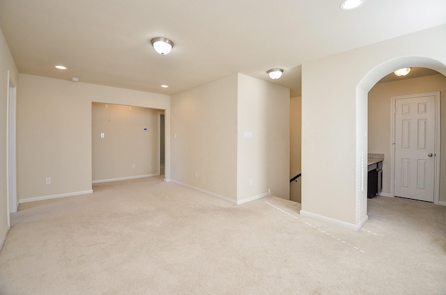 spare room with light colored carpet