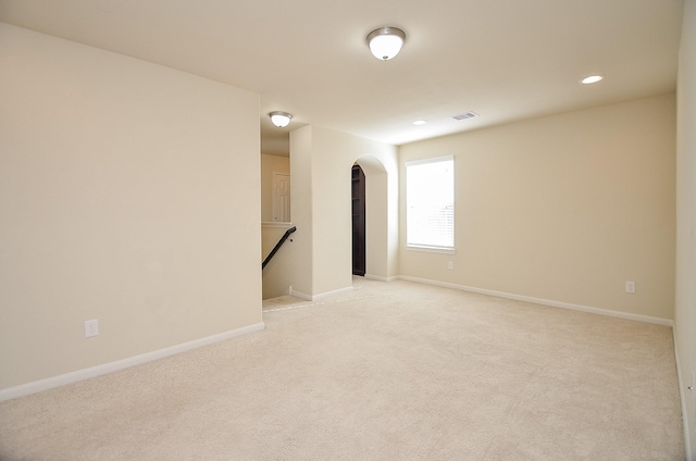 spare room with light colored carpet