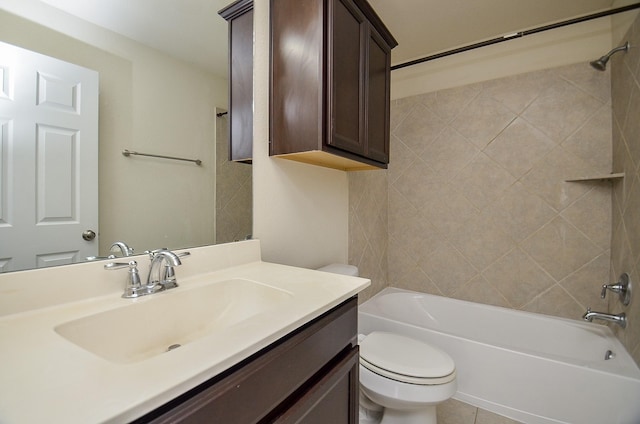 full bathroom featuring tile patterned floors, vanity, toilet, and tiled shower / bath