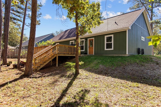 back of house with a wooden deck