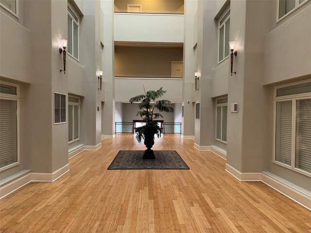 2208 Post Office St Unit 105, Galveston, TX 77550 - entryway with a towering ceiling and wood finished floors