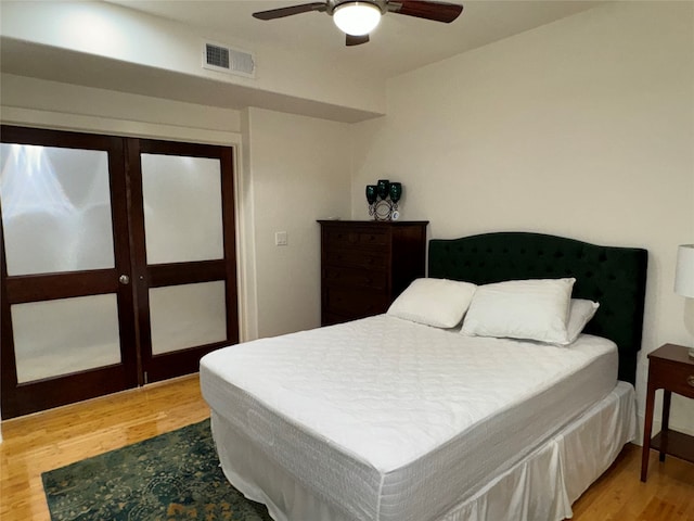 bedroom featuring ceiling fan and hardwood / wood-style flooring