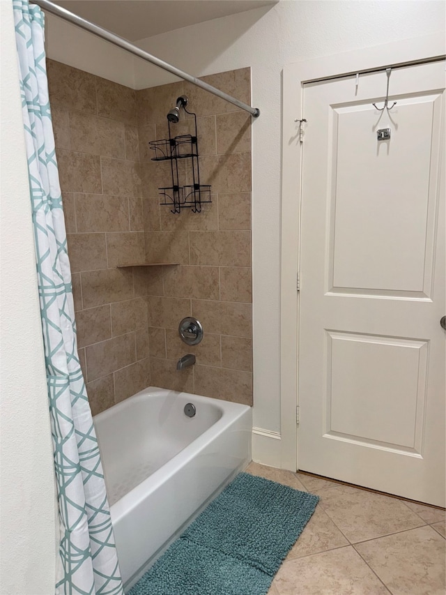 bathroom with tile patterned flooring and shower / bath combo with shower curtain