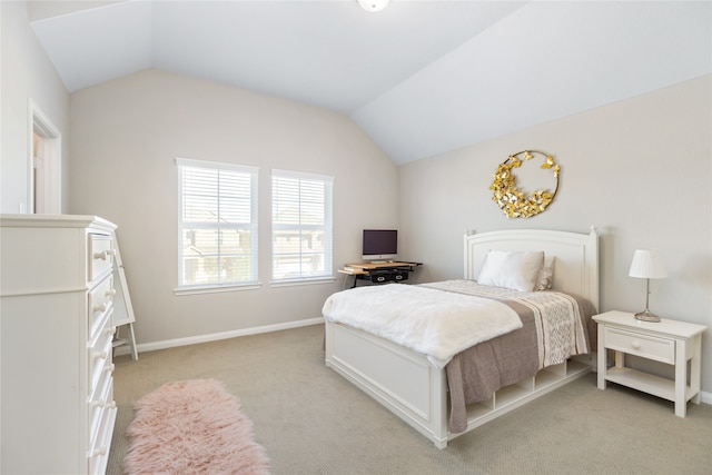 carpeted bedroom featuring vaulted ceiling