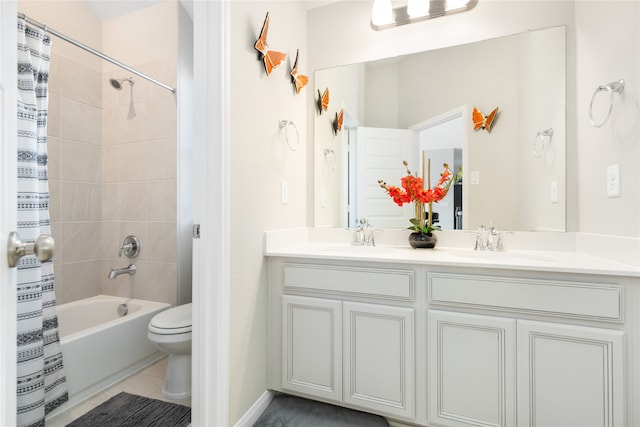 full bathroom with shower / bath combo, vanity, tile patterned floors, and toilet