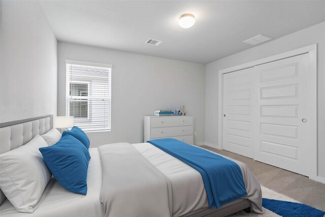 6703 Old Cypress Landing Ln, Humble, TX 77338 - carpeted bedroom with visible vents and a closet