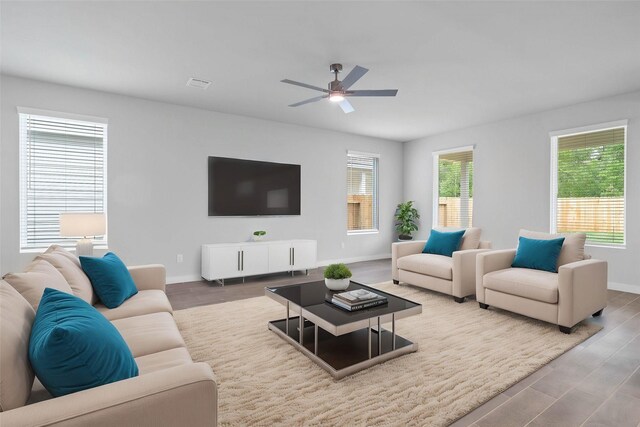 6703 Old Cypress Landing Ln, Humble, TX 77338 - living room with visible vents, baseboards, a ceiling fan, and wood finished floors