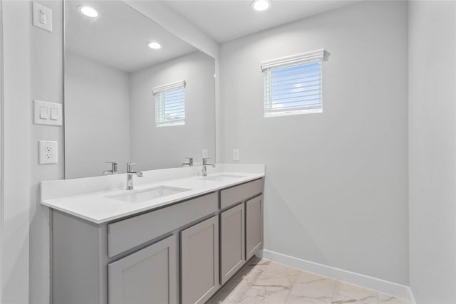 6703 Old Cypress Landing Ln, Humble, TX 77338 - full bath with marble finish floor, a sink, baseboards, and recessed lighting