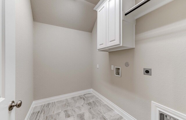 washroom featuring washer hookup, cabinets, hookup for an electric dryer, and gas dryer hookup