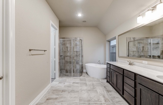 bathroom featuring lofted ceiling, vanity, and separate shower and tub