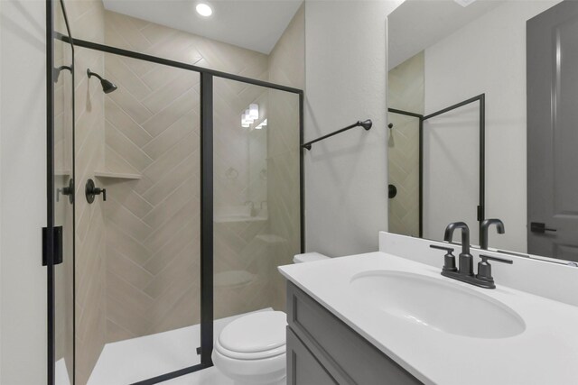 16179 Sheridan River Trl, Conroe, TX 77302 - bathroom with toilet, a shower stall, vanity, and recessed lighting