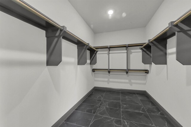 16179 Sheridan River Trl, Conroe, TX 77302 - spacious closet featuring dark marble finish flooring