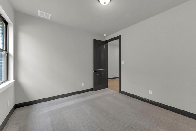 16179 Sheridan River Trl, Conroe, TX 77302 - spare room with carpet flooring and baseboards