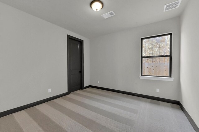 16179 Sheridan River Trl, Conroe, TX 77302 - spare room featuring baseboards and carpet floors