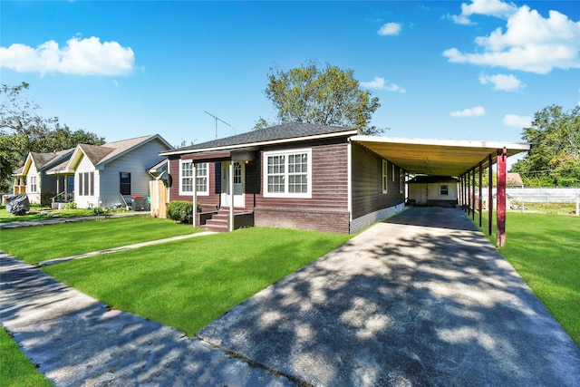 view of front facade with a front yard and a carport