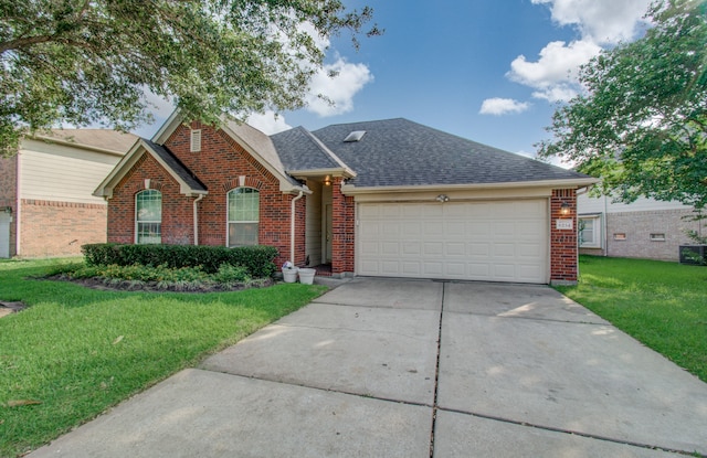 view of front facade featuring a front yard and a garage