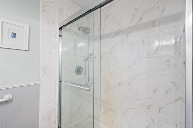 bathroom with a shower with shower door