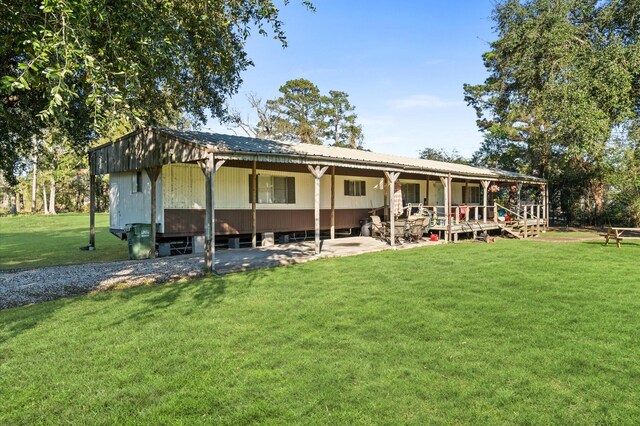 rear view of house with a lawn