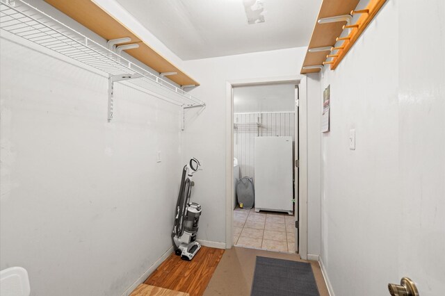 walk in closet featuring light wood-type flooring