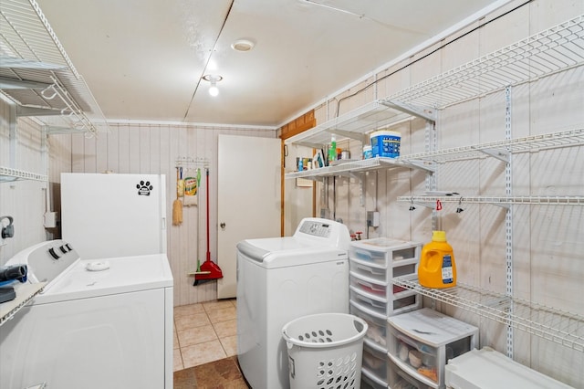 washroom featuring washer and dryer and tile patterned floors