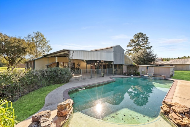 view of pool with an in ground hot tub and a patio area