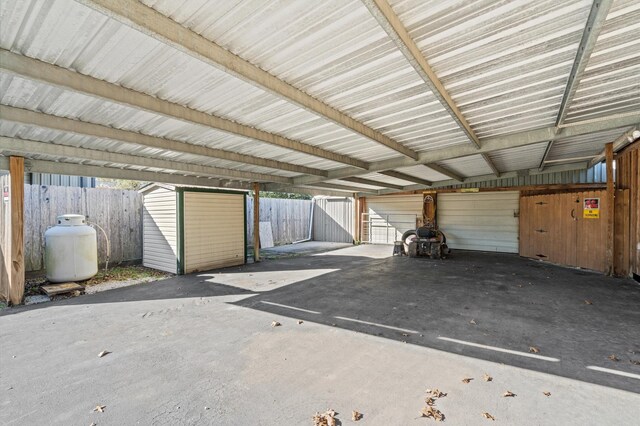 garage featuring a carport