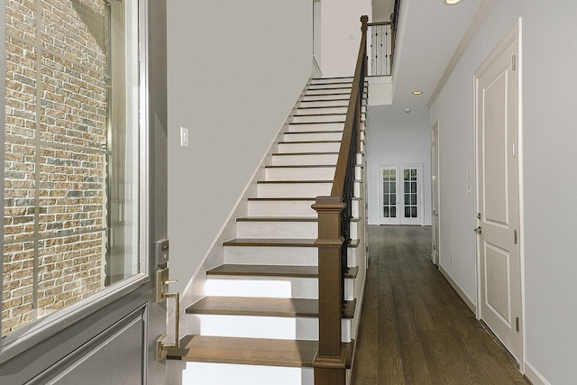 stairs with hardwood / wood-style flooring