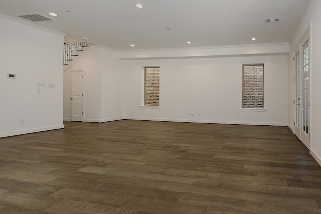 unfurnished room featuring crown molding and dark wood-type flooring