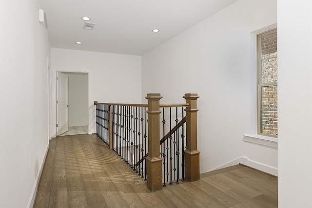 hall with dark hardwood / wood-style flooring