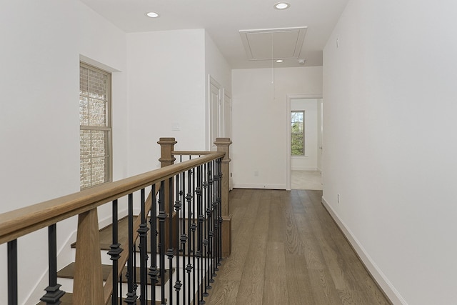 corridor with hardwood / wood-style floors