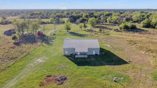 birds eye view of property featuring a rural view