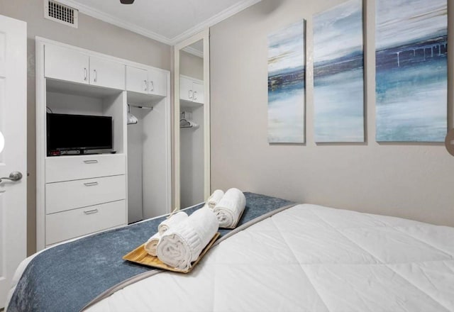 6102 Seawall Blvd Unit 318, Galveston, TX 77551 - bedroom with visible vents and crown molding