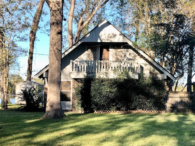 1544 E Taylor Lake Cir, Livingston, TX 77351 - view of property exterior featuring a balcony and board and batten siding