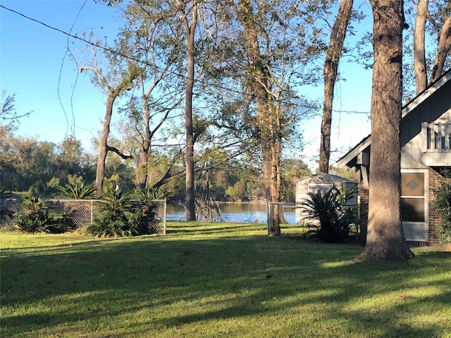 1544 E Taylor Lake Cir, Livingston, TX 77351 - view of yard with a water view