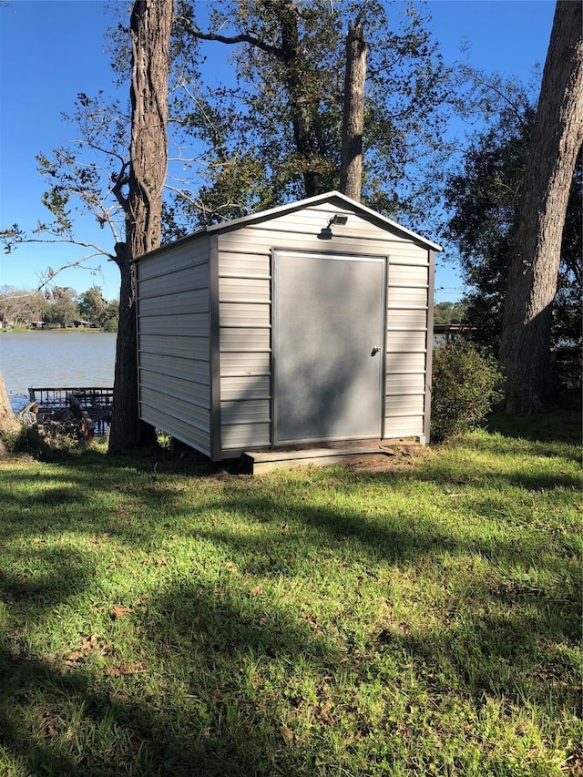 1544 E Taylor Lake Cir, Livingston, TX 77351 - view of shed featuring a water view