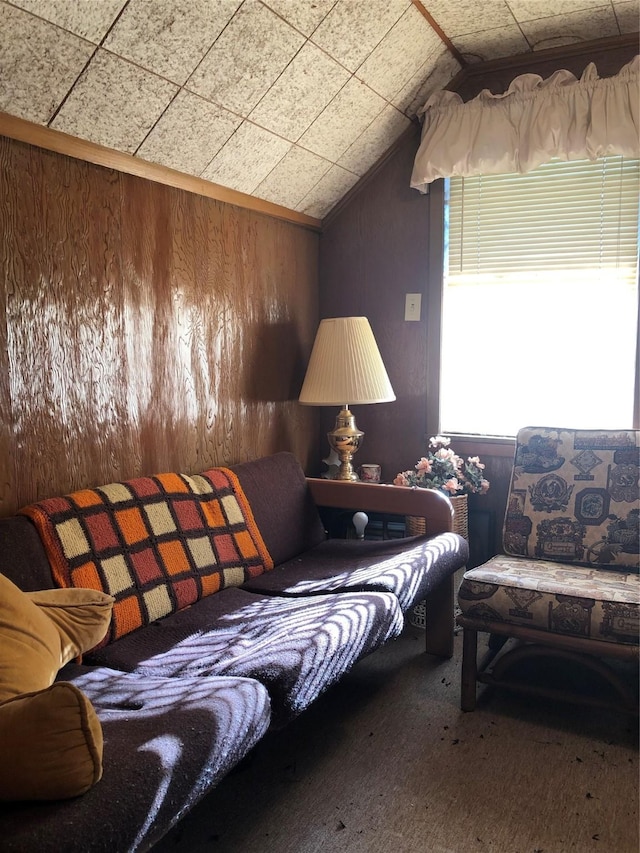 1544 E Taylor Lake Cir, Livingston, TX 77351 - living area featuring vaulted ceiling, carpet floors, and wooden walls