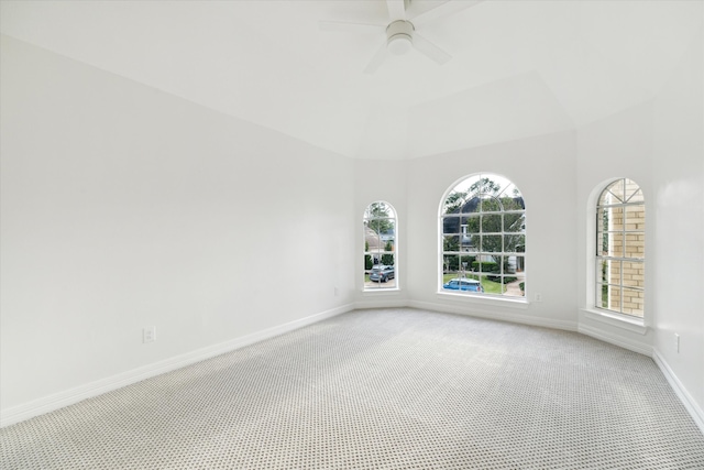 carpeted empty room featuring ceiling fan