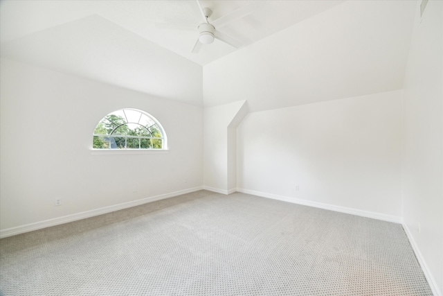 additional living space with ceiling fan, carpet floors, and vaulted ceiling