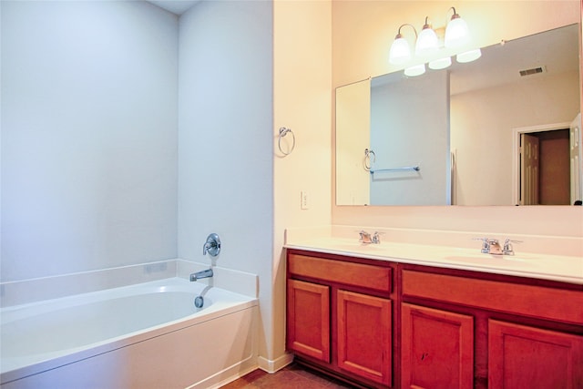 full bathroom featuring a bath, double vanity, visible vents, and a sink