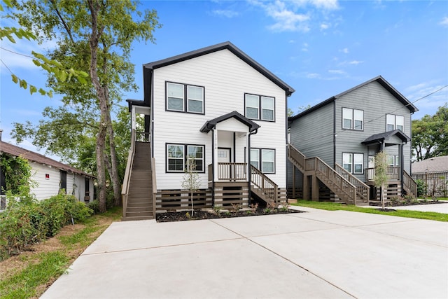 view of front of house with stairs