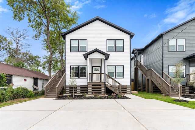 view of front of property with stairs