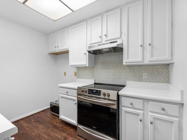 kitchen with stainless steel electric stove, backsplash, white cabinets, and dark hardwood / wood-style floors