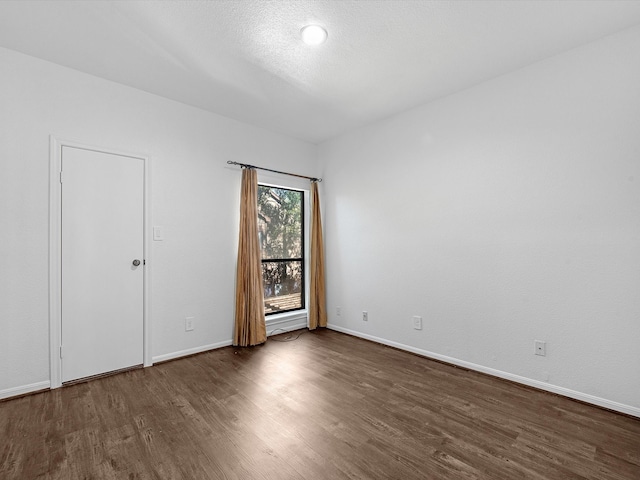 unfurnished bedroom featuring dark wood-type flooring